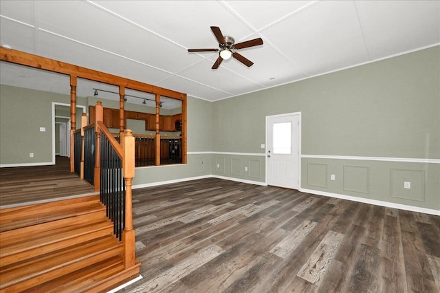 unfurnished room featuring ceiling fan and dark wood-type flooring