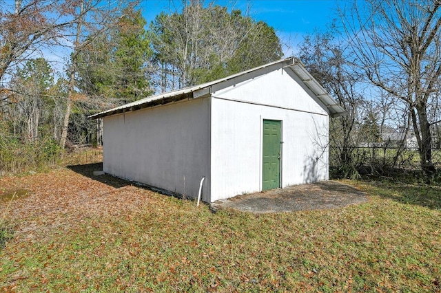 view of outbuilding featuring a yard