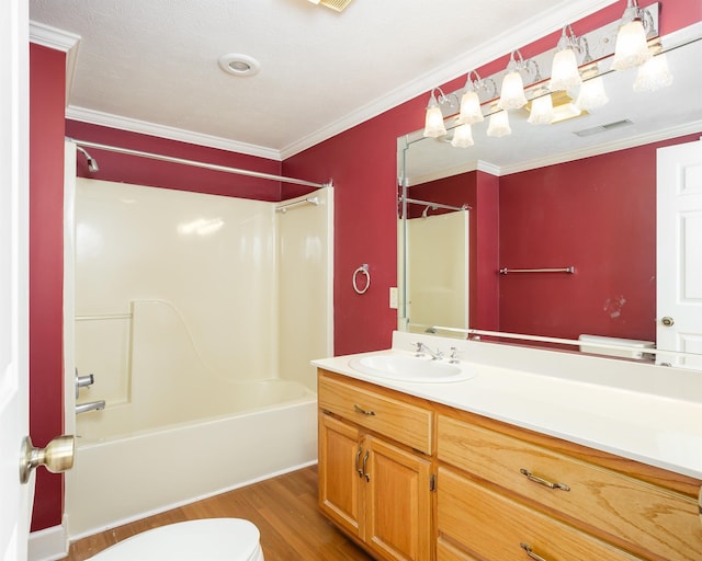 full bathroom featuring shower / bathing tub combination, hardwood / wood-style floors, ornamental molding, and toilet