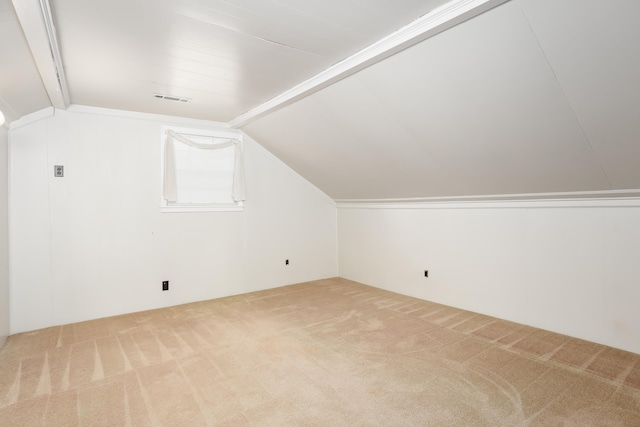 bonus room featuring vaulted ceiling and carpet flooring