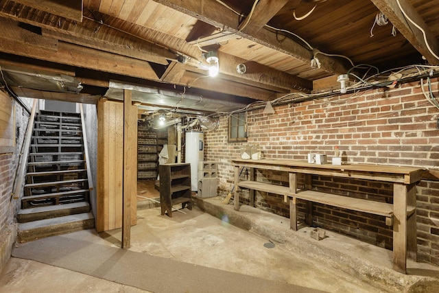 basement with brick wall and water heater