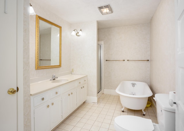 full bathroom with independent shower and bath, tile patterned flooring, vanity, toilet, and a textured ceiling