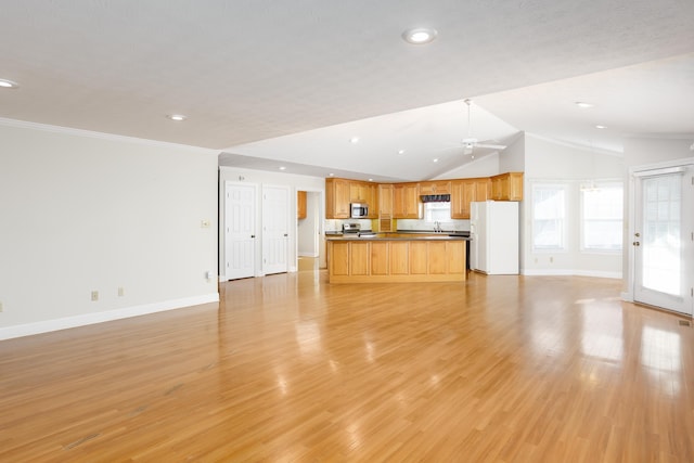 unfurnished living room with crown molding, ceiling fan, lofted ceiling, and light wood-type flooring