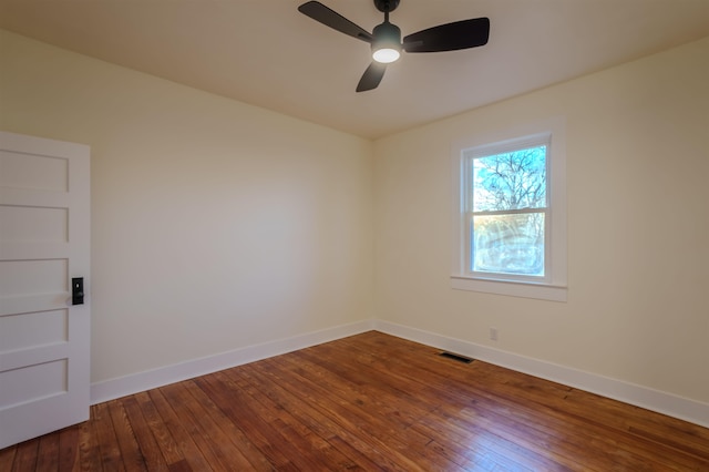 empty room featuring ceiling fan and hardwood / wood-style floors