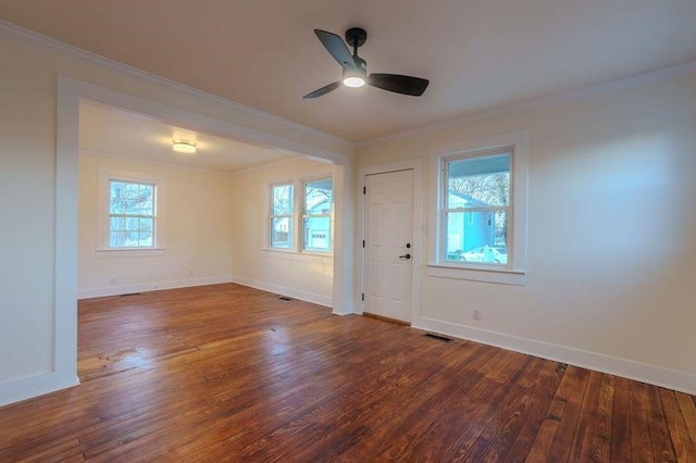 spare room with wood-type flooring, ceiling fan, and crown molding