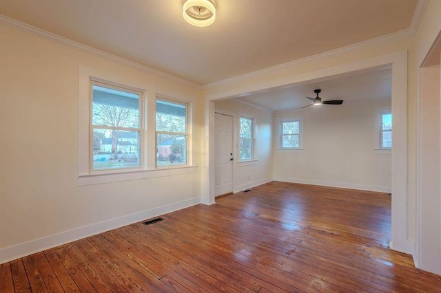 unfurnished room with wood-type flooring, ceiling fan, and crown molding