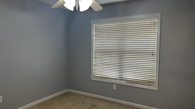 carpeted empty room with ceiling fan