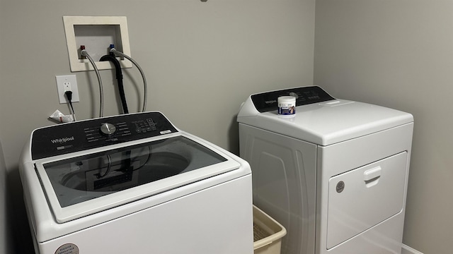 washroom featuring independent washer and dryer