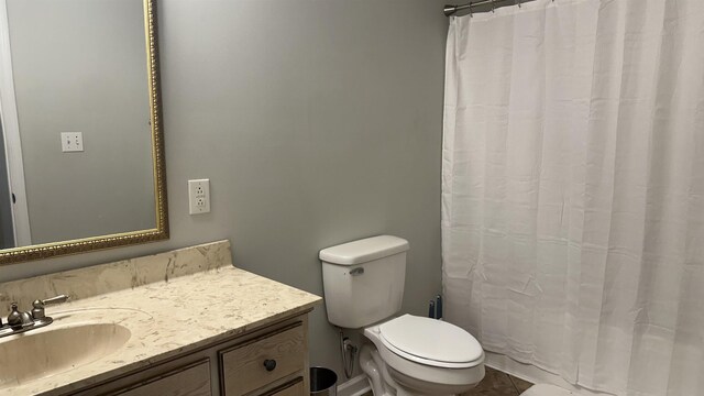 bathroom featuring tile patterned floors, vanity, and toilet