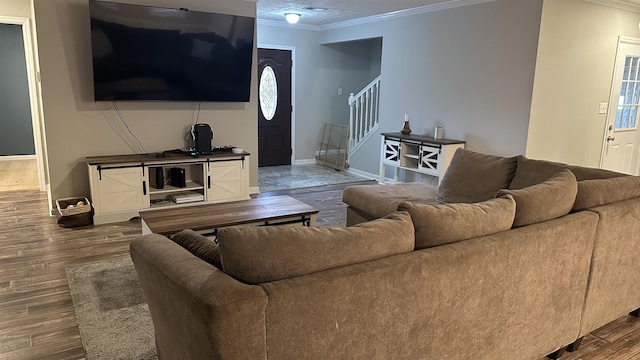 living room with wood-type flooring and crown molding