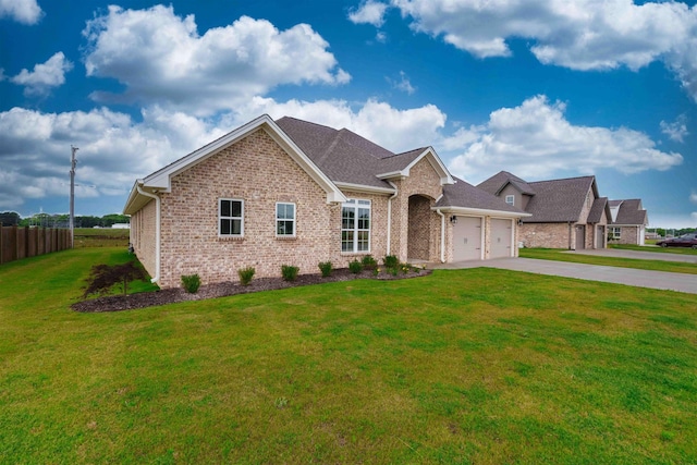  - view of front of house with an attached garage, brick siding, and concrete driveway