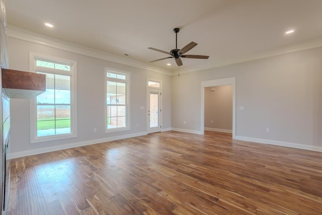  - unfurnished living room with ornamental molding, ceiling fan, wood finished floors, and recessed lighting