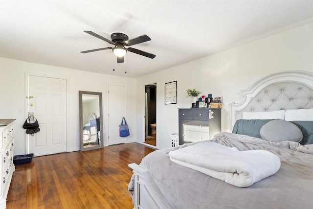 bedroom featuring dark wood-type flooring and ceiling fan