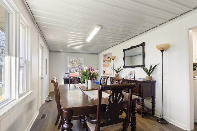 dining area with dark hardwood / wood-style flooring