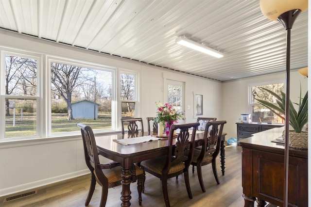 dining area with plenty of natural light and light hardwood / wood-style floors