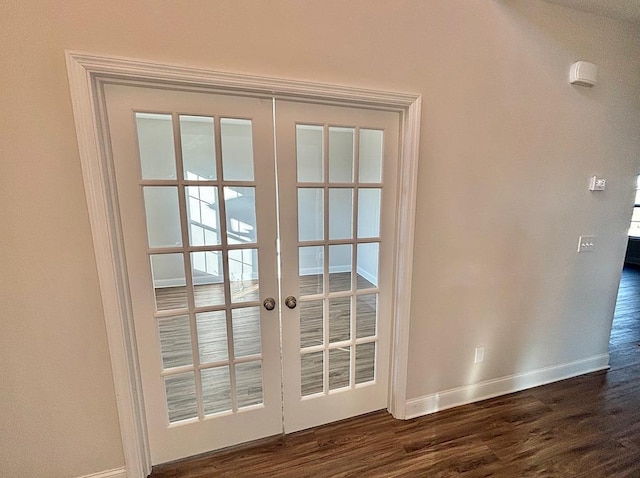 doorway to outside featuring dark wood-type flooring and french doors