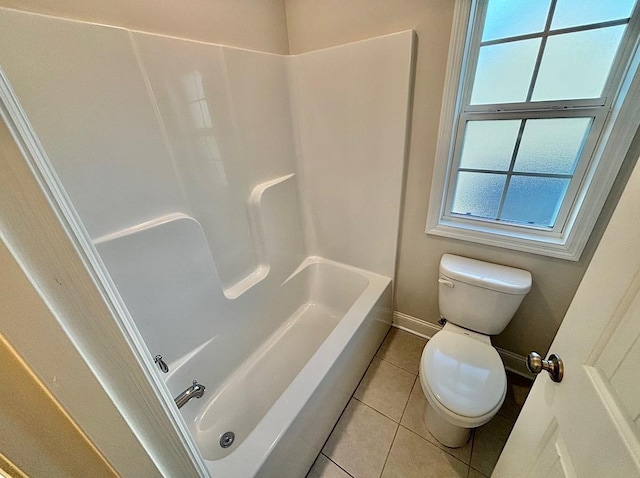 bathroom featuring toilet, tub / shower combination, and tile patterned floors