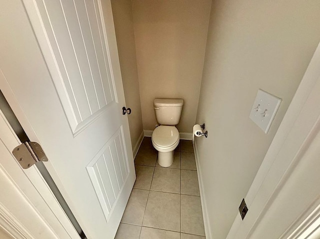 bathroom featuring tile patterned flooring and toilet