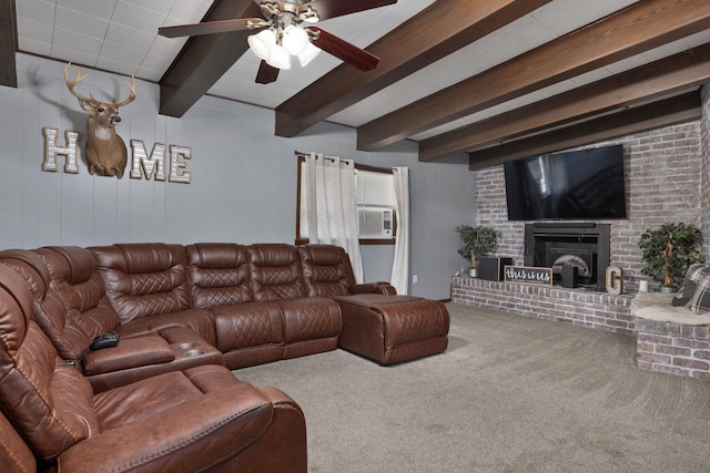  - living area featuring beamed ceiling, carpet flooring, a ceiling fan, and a brick fireplace