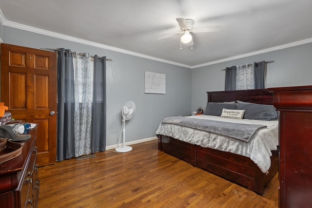  - bedroom with wood finished floors, ornamental molding, and a ceiling fan