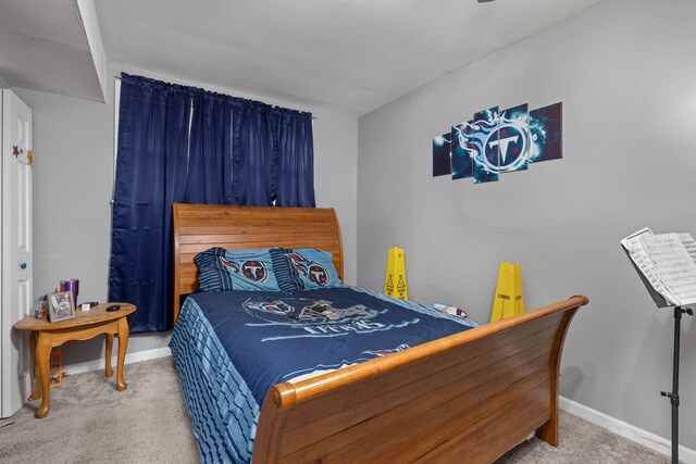  - carpeted bedroom featuring baseboards