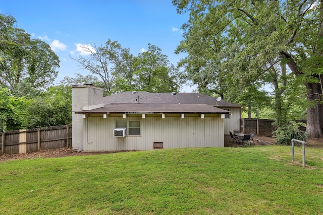  - back of property with a chimney and a fenced backyard