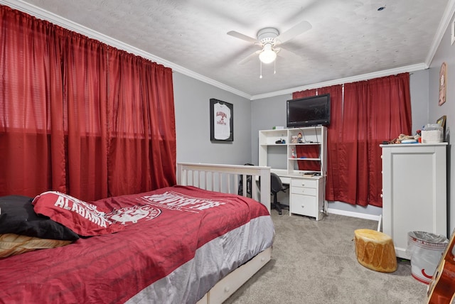  - carpeted bedroom featuring crown molding, a ceiling fan, and a desk