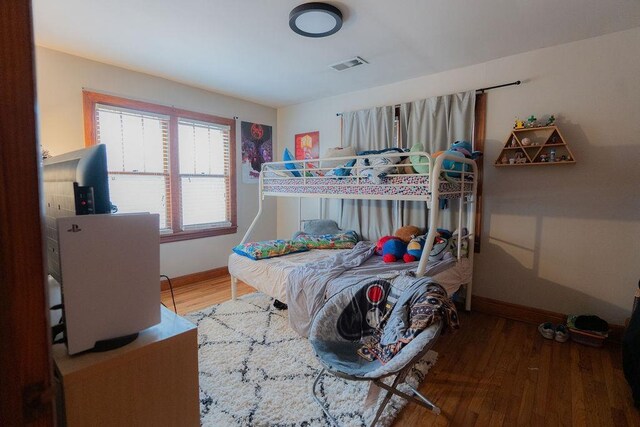 bedroom with wood-type flooring