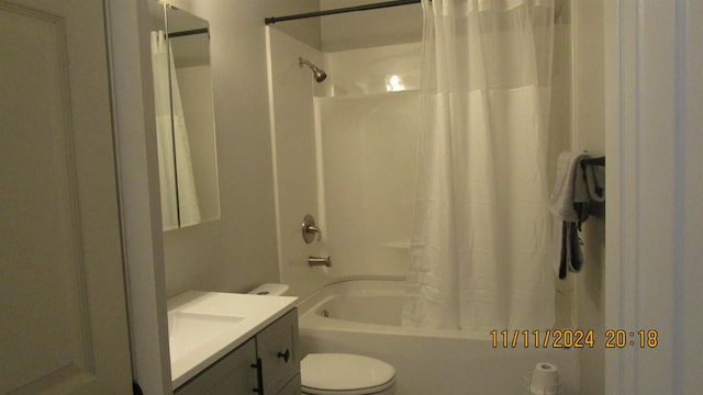 full bathroom with vanity, toilet, and shower / tub combo