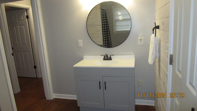 bathroom featuring vanity and hardwood / wood-style flooring