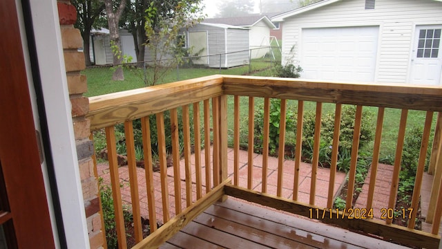 wooden terrace with a shed