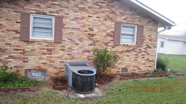 view of property exterior with central AC