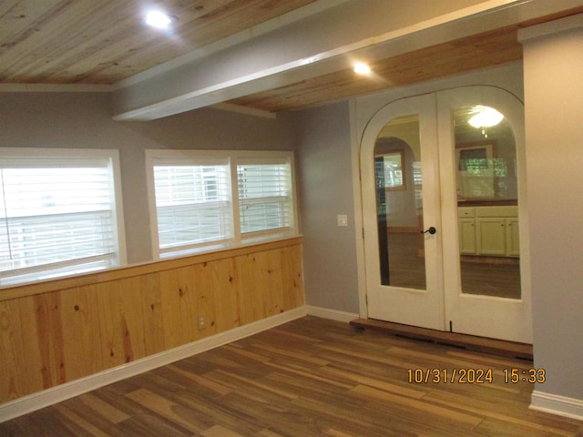 interior space featuring french doors, wooden ceiling, wooden walls, and wood-type flooring