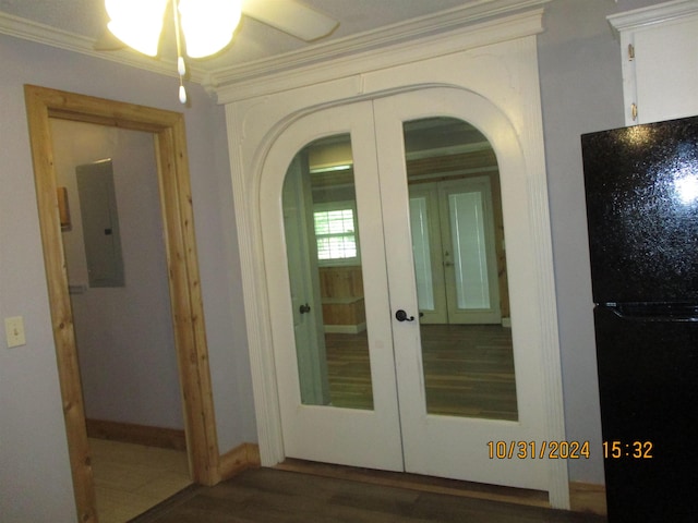 hallway featuring ornamental molding, dark wood-type flooring, electric panel, and french doors