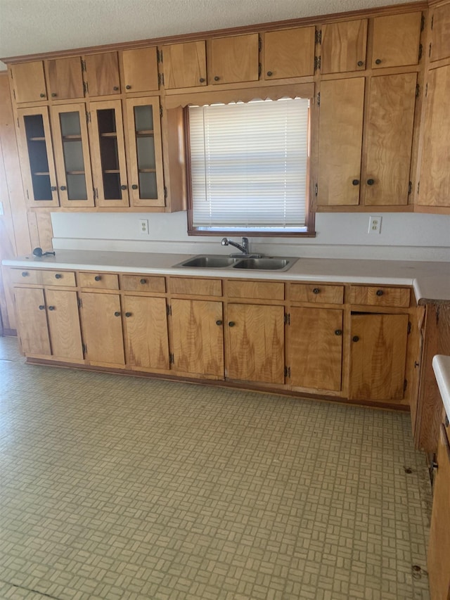 kitchen with sink and a textured ceiling