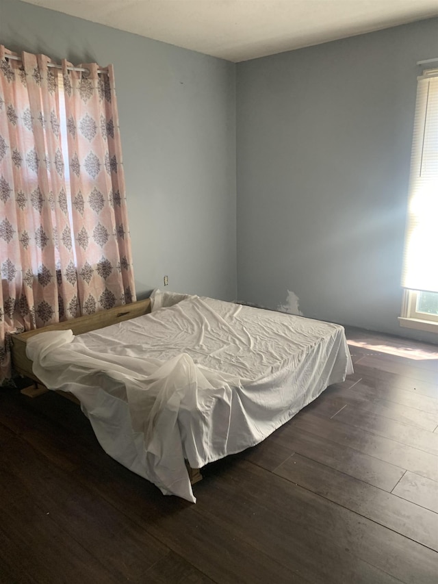 bedroom featuring dark wood-type flooring