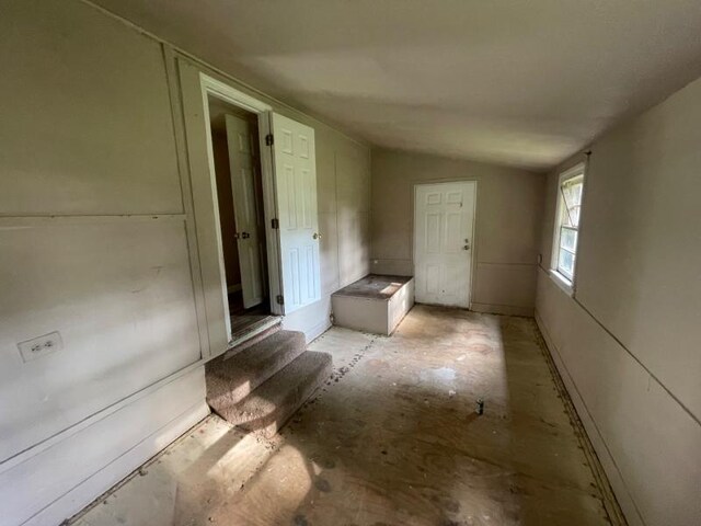  - spare room featuring vaulted ceiling