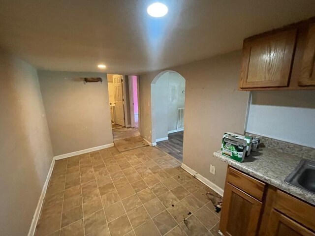  - kitchen with arched walkways and recessed lighting