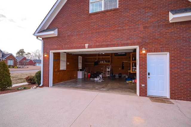 garage featuring driveway