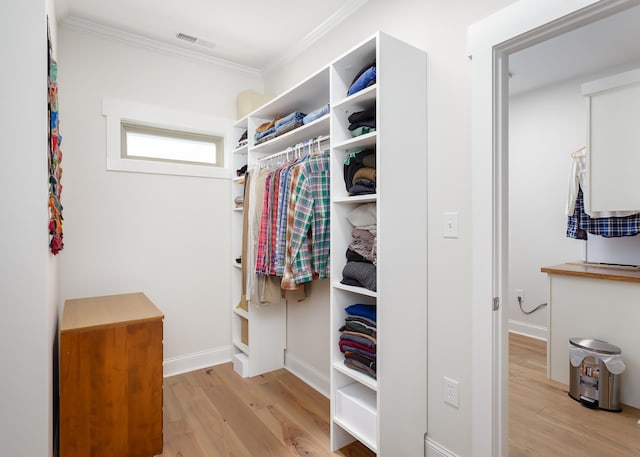 spacious closet with light hardwood / wood-style floors