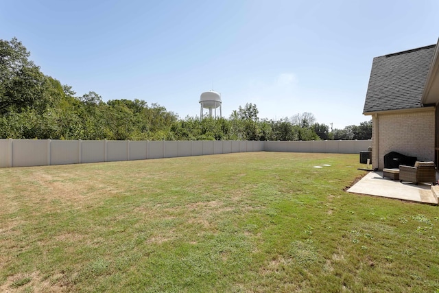 view of yard with a patio and central AC