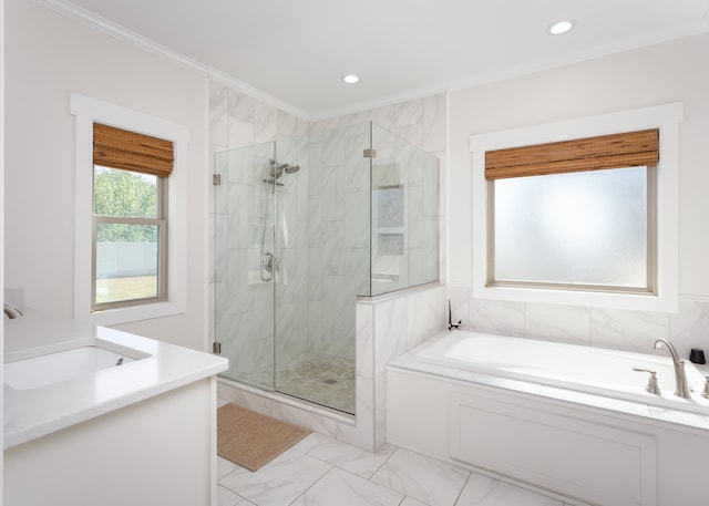 bathroom featuring vanity, crown molding, and shower with separate bathtub