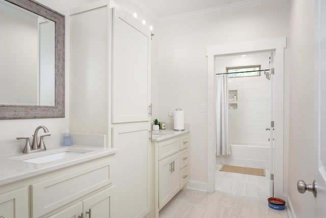 bathroom featuring vanity, crown molding, and shower / bath combo