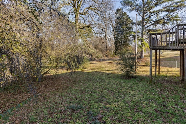 view of yard featuring a wooden deck