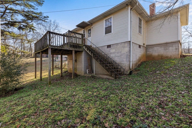 view of home's exterior with a wooden deck