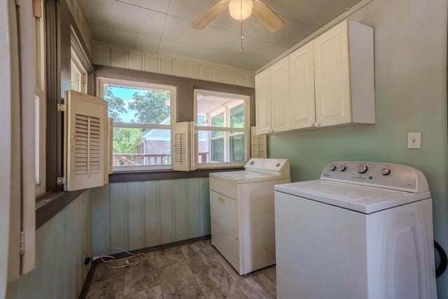 washroom featuring washer and clothes dryer, ceiling fan, and cabinets