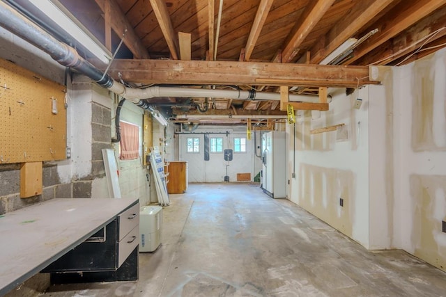 basement featuring white refrigerator