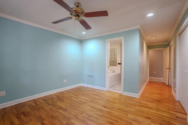 unfurnished bedroom featuring ensuite bathroom, light hardwood / wood-style flooring, ceiling fan, and ornamental molding