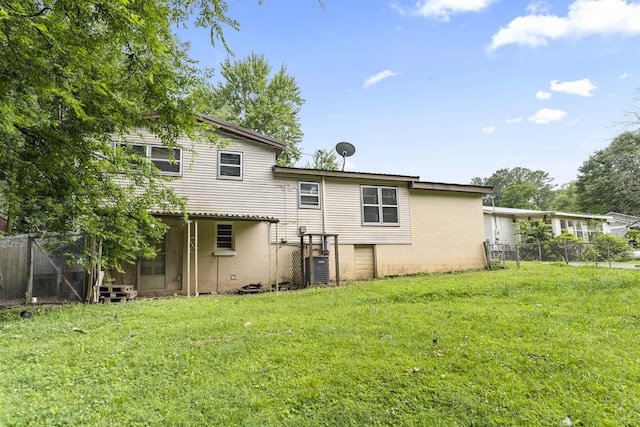  - back of property featuring concrete block siding