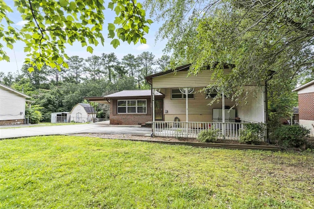  - tri-level home with a front yard and concrete driveway